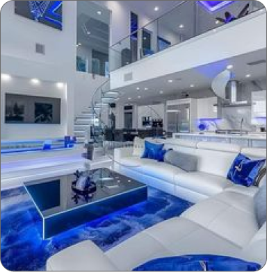 Comfortable office with plants, wooden desk, and two black chairs